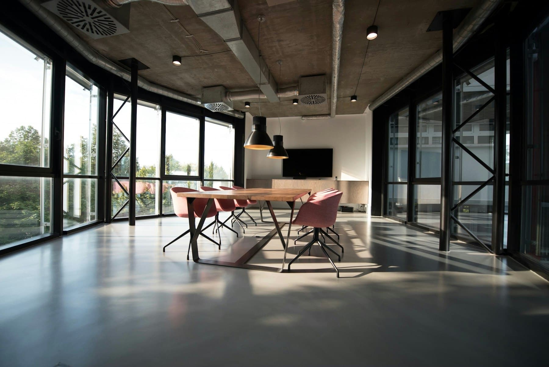 A sunlit conference room looking onto the street